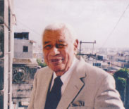 Richard Egües on his balcony in 2006. © Sue Miller.